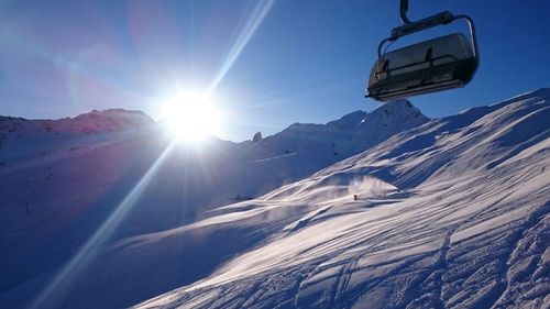 Scenic view of snow covered mountains against sky