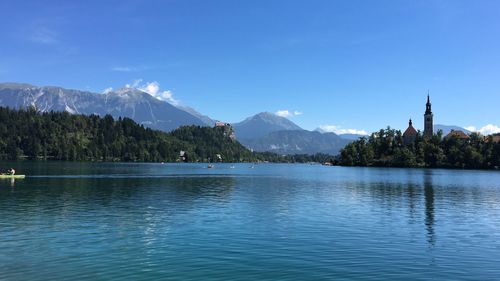 Scenic view of lake and mountains against sky