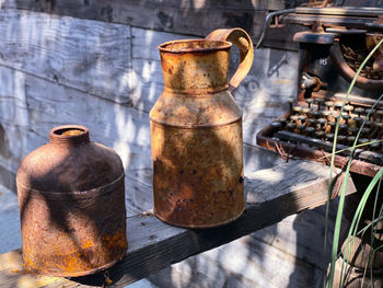 High angle view of old rusty metal on wood