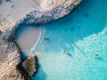 High angle view of rocks in sea