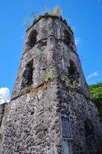 Low angle view of built structure against blue sky