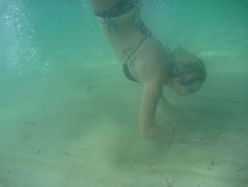 Woman swimming in sea