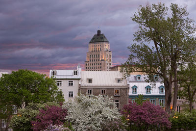 View of buildings against cloudy sky