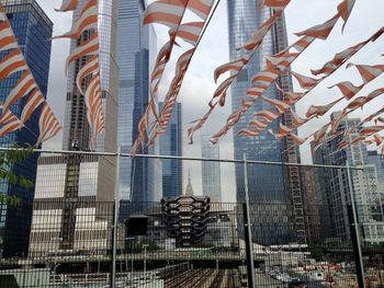 Hudson yards, new yor city with white and red bunting, the vessel and empire state building