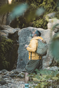 Man looking up amazed in the forest