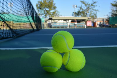 Close-up of tennis balls on sports court