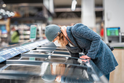 Side view of man working in winter