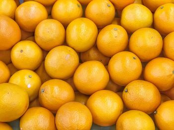 Full frame shot of oranges in market