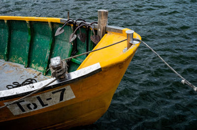 High angle view of yellow boat moored in sea