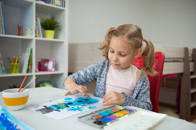 Girl painting at home