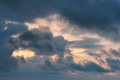 Low angle view of cloudy sky during sunset