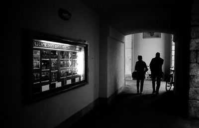 Rear view of man walking on street