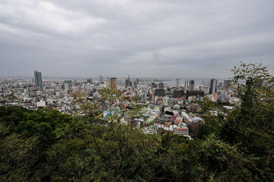 High angle view of trees and buildings against sky