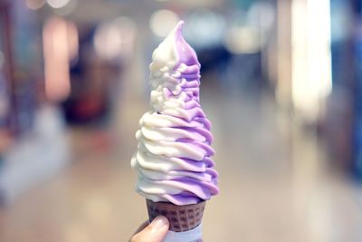 Close-up of hand holding ice cream