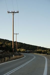 Empty road against clear sky