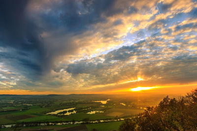 Scenic view of landscape against sky during sunset