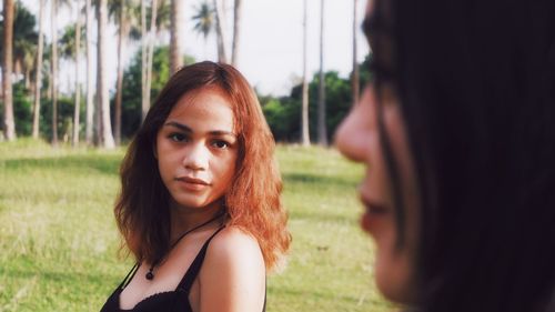 Portrait of young woman looking away