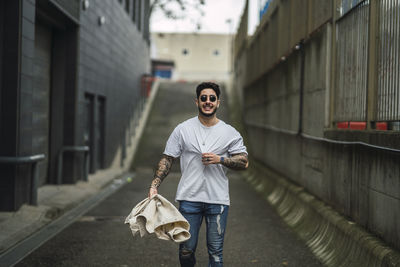 Full length of man standing in city