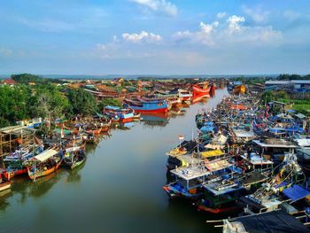 High angle view of boats moored at harbor