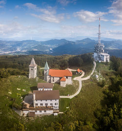 High angle view of trees and buildings against sky