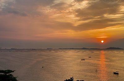 Scenic view of beach against sky during sunset