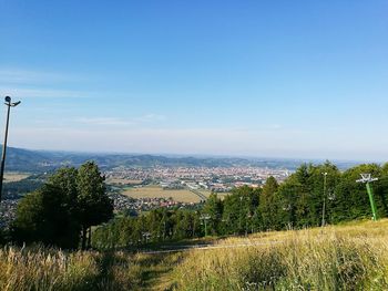 View of cityscape against blue sky