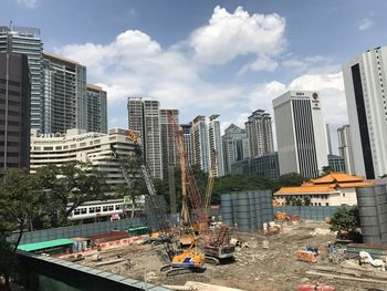 Modern buildings in city against sky
