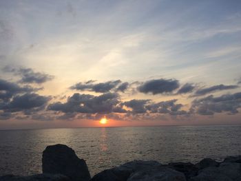 Scenic view of sea against sky at sunset