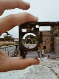 Midsection of person holding camera