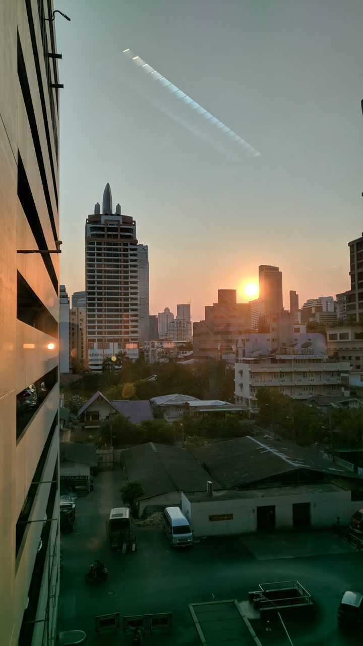 BUILDINGS IN CITY AGAINST SKY