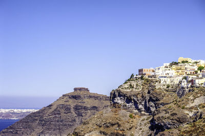 Scenic view of rocky mountain against clear blue sky