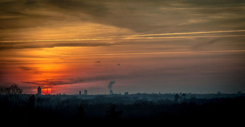 Scenic view of silhouette landscape against sky during sunset