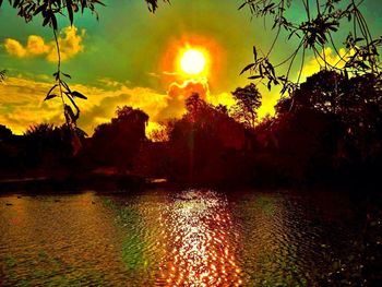 Scenic view of lake at sunset