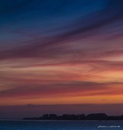 Scenic view of sea against sky at sunset