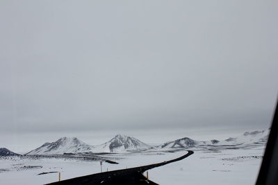 Scenic view of snow covered mountains