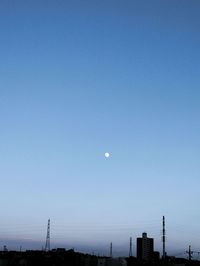 Scenic view of moon against clear blue sky