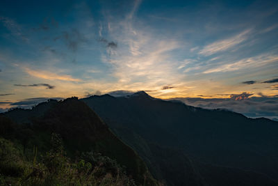 Scenic view of mountains against sky during sunset