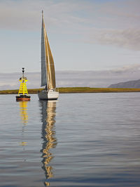 Sailboat in calm weather close to reykjavik