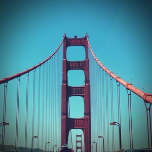 Low angle view of bridge against blue sky