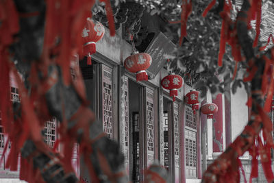 Close-up of lantern hanging on building