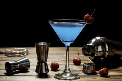 Close-up of wine glasses on table