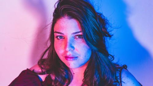 Portrait of young woman at home