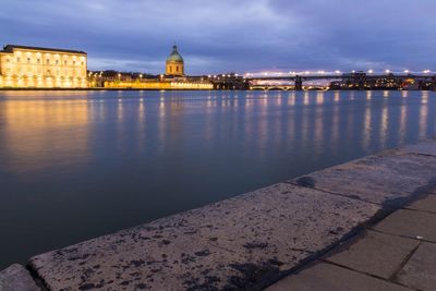 Illuminated buildings at waterfront