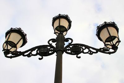 Low angle view of street light against sky