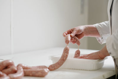 Midsection of woman preparing food