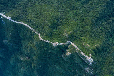Great wall of china on green landscape