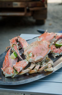 Close-up of serving food in plate on table