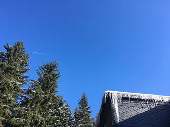 Low angle view of building against clear blue sky