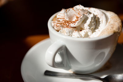 Close-up of coffee cup on table