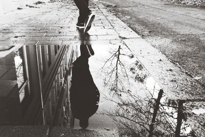 Silhouette of person standing in alley